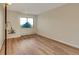Bedroom with wood floors, a window and neutral paint at 13961 E Marina Dr # 409, Aurora, CO 80014