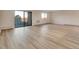 Bright living room with wood-look floors, large sliding glass doors to a balcony, and scenic views at 13961 E Marina Dr # 409, Aurora, CO 80014