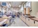 Large community workshop space with various tools, workbenches, and storage cabinets at 13961 E Marina Dr # 409, Aurora, CO 80014
