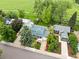 Bright two-story home with lush landscaping, mature trees, and a two-car garage at 236 W Sycamore Ln, Louisville, CO 80027