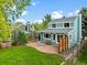 Turquoise two-story house with patio, lawn, and well-kept yard at 236 W Sycamore Ln, Louisville, CO 80027
