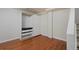 Spacious finished basement area with wood laminate flooring and ample storage space at 236 W Sycamore Ln, Louisville, CO 80027