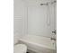 Cozy bathroom features a white tub with shower and white subway tile at 236 W Sycamore Ln, Louisville, CO 80027