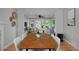 Open concept dining and living area with hardwood floors and ample light at 236 W Sycamore Ln, Louisville, CO 80027
