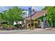 Historic building with charming details, featuring outdoor seating and lush landscaping, perfect for relaxing at 236 W Sycamore Ln, Louisville, CO 80027