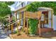 A charming storefront with lush greenery, offering a warm and inviting atmosphere for patrons at 236 W Sycamore Ln, Louisville, CO 80027