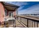 Covered balcony with outdoor seating offers views of the surrounding community and beautiful sky at 917 W 129Th Pl, Denver, CO 80234