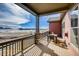 Covered balcony with outdoor seating offers views of the surrounding community and open space at 917 W 129Th Pl, Denver, CO 80234
