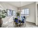 Bright dining area features a modern chandelier, round table, and large window with community views at 917 W 129Th Pl, Denver, CO 80234