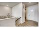 Bright entryway featuring hardwood floors, white walls and trim, leading to stairs at 917 W 129Th Pl, Denver, CO 80234