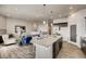 Bright open concept kitchen with large island, dining area, and easy access to the living area at 917 W 129Th Pl, Denver, CO 80234