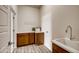 Laundry room featuring plenty of counter space and cabinet storage above and below at 917 W 129Th Pl, Denver, CO 80234