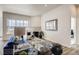 Bright living room featuring modern furnishings, fireplace, and a large window for natural light at 917 W 129Th Pl, Denver, CO 80234