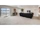 Spacious living room with sliding glass doors, contemporary furnishings, and abundant natural light for a comfortable retreat at 917 W 129Th Pl, Denver, CO 80234