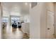 Open concept living room with hardwood floors leading into a dining area near large windows at 917 W 129Th Pl, Denver, CO 80234