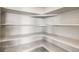 Walk-in pantry featuring white shelves and storage with a simple and clean design at 917 W 129Th Pl, Denver, CO 80234