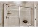 Walk-in shower with a glass door and built-in niche at 917 W 129Th Pl, Denver, CO 80234