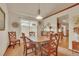 Charming dining room with wood trim, a pendant light, and a bay window at 2038 S Hoyt Way, Lakewood, CO 80227
