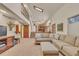 Spacious living room with skylight, fireplace, and an open layout at 2038 S Hoyt Way, Lakewood, CO 80227