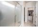 Shower features glass door and leads to bathroom and closet at 6664 Merrimack Dr, Castle Pines, CO 80108