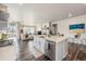 Stylish eat-in kitchen with modern appliances and sight lines into the open concept living area at 6664 Merrimack Dr, Castle Pines, CO 80108