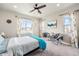 Bright main bedroom features two windows and neutral-toned decor at 6664 Merrimack Dr, Castle Pines, CO 80108