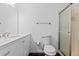 Bathroom featuring a vanity, toilet, and walk-in shower with sliding glass door at 7220 S Gaylord St # G17, Littleton, CO 80122
