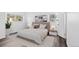 Inviting bedroom with neutral tones, stylish decor, and wood-style flooring for a tranquil retreat at 7220 S Gaylord St # G17, Littleton, CO 80122
