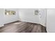 Bright bedroom with wood-style floors and ample natural light creating a serene atmosphere at 7220 S Gaylord St # G17, Littleton, CO 80122