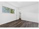 Bedroom with modern gray flooring, bright window, and open closet at 7220 S Gaylord St # G17, Littleton, CO 80122
