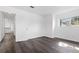 Bedroom with modern gray flooring, a bright window, and an open closet at 7220 S Gaylord St # G17, Littleton, CO 80122