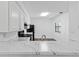 Bright kitchen with sleek white countertop offering a spacious feel and modern appeal at 7220 S Gaylord St # G17, Littleton, CO 80122