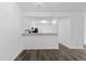 Bright kitchen featuring white cabinets, stone countertops, and modern fixtures at 7220 S Gaylord St # G17, Littleton, CO 80122