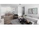 Bright living room features modern decor, wood floors and comfortable seating for a relaxing atmosphere at 7220 S Gaylord St # G17, Littleton, CO 80122