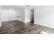 Spacious open-concept living room offers hardwood floors and bright white walls at 7220 S Gaylord St # G17, Littleton, CO 80122