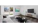 Bright living room features modern decor, sleek furniture, and hardwood floors at 7220 S Gaylord St # G17, Littleton, CO 80122