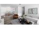 Inviting living room boasts neutral colors, contemporary furnishings, and stylish decor at 7220 S Gaylord St # G17, Littleton, CO 80122