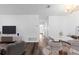 Modern living room with hardwood floors, an open floor plan, and neutral colors throughout at 7220 S Gaylord St # G17, Littleton, CO 80122