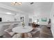 Open-concept living space with dining area, breakfast bar, and plenty of natural light at 7220 S Gaylord St # G17, Littleton, CO 80122