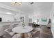 Cozy living room featuring hardwood floors, an open floor plan, breakfast bar, and natural light at 7220 S Gaylord St # G17, Littleton, CO 80122