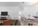Open-concept space with living room, dining area, and wood-style floors offering a seamless flow at 7220 S Gaylord St # G17, Littleton, CO 80122