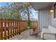 Cozy patio with a small table, chairs, and a partial view of the neighborhood at 7220 S Gaylord St # G17, Littleton, CO 80122