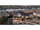 Aerial view of this home showcasing its three car garage, beautiful landscaping, and large lot at 948 Buffalo Ridge Rd, Castle Pines, CO 80108