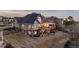 Expansive back exterior with a multi-level deck and patio, providing various spaces for outdoor activities and relaxation at 948 Buffalo Ridge Rd, Castle Pines, CO 80108