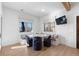 Bright breakfast nook with modern table, cushioned bench seating, and natural light, creating a cozy space at 948 Buffalo Ridge Rd, Castle Pines, CO 80108