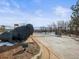 Community entrance featuring a large buffalo statue and a gated entry under a blue sky at 948 Buffalo Ridge Rd, Castle Pines, CO 80108