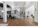 Grand foyer with a soaring ceiling, a stunning chandelier, and hardwood floors at 948 Buffalo Ridge Rd, Castle Pines, CO 80108
