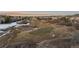 Scenic aerial view of the golf course surrounding the neighborhood at 948 Buffalo Ridge Rd, Castle Pines, CO 80108
