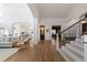 Beautiful hallway with views of the kitchen, stairs, and living room at 948 Buffalo Ridge Rd, Castle Pines, CO 80108