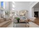 Spacious living room with high ceilings, large windows, and neutral decor, perfect for relaxation at 948 Buffalo Ridge Rd, Castle Pines, CO 80108